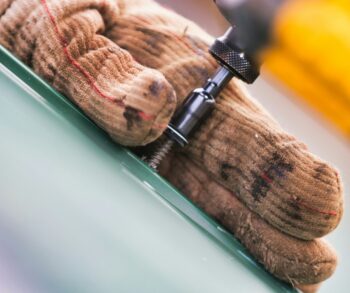 a teddy bear with a screwdriver attached to it